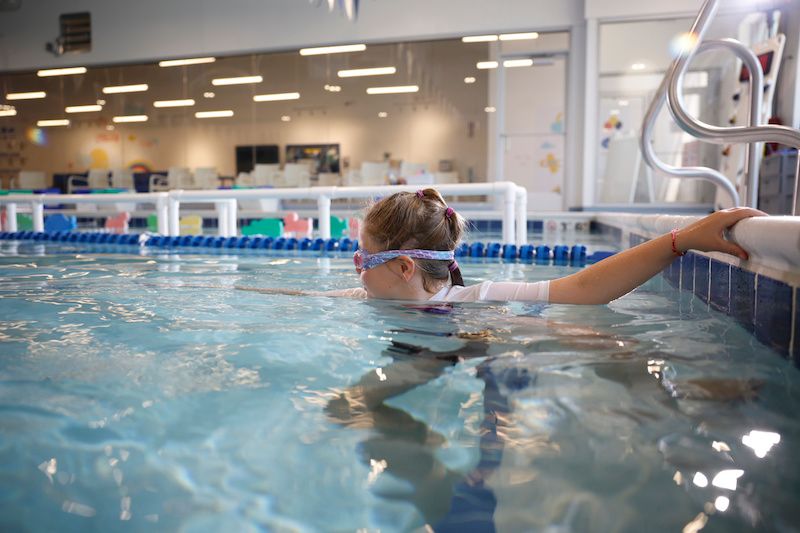Girl engaging in her year-round swimming lessons