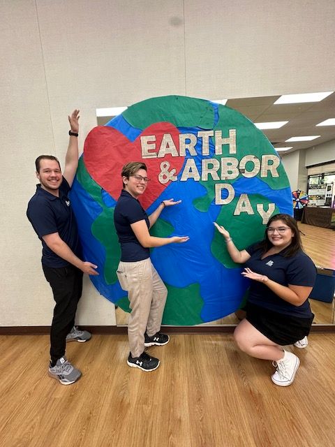 Big Blue Gilbert team celebrating Earth and Arbor Day