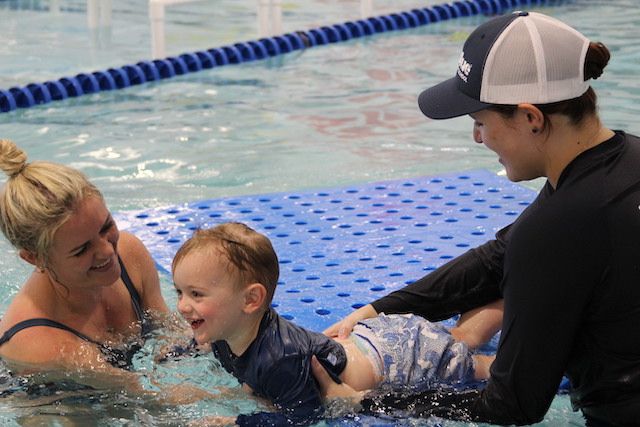 Yasmin teaching swim lessons to one of her students in the pool